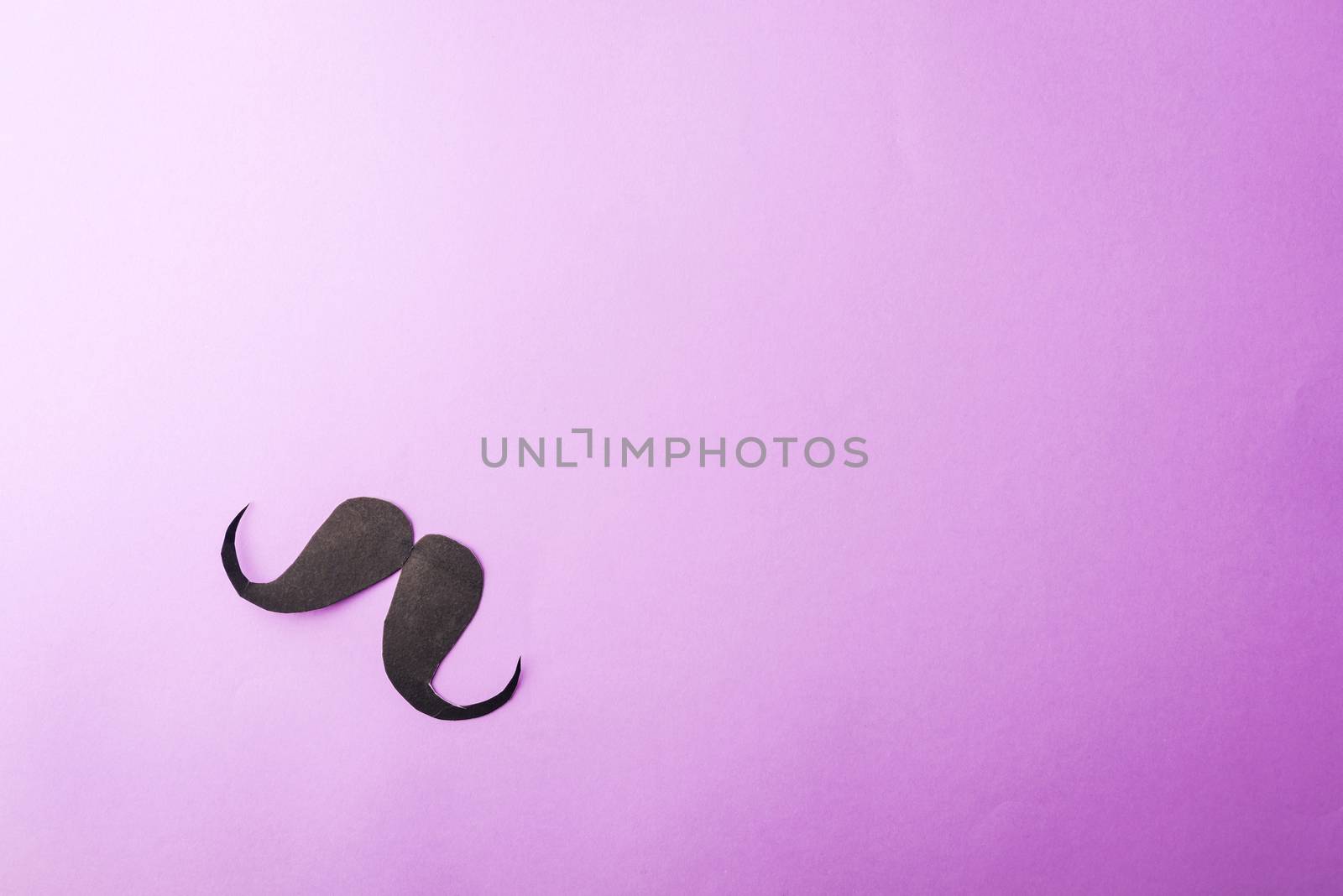Black mustache paper on purple by Sorapop