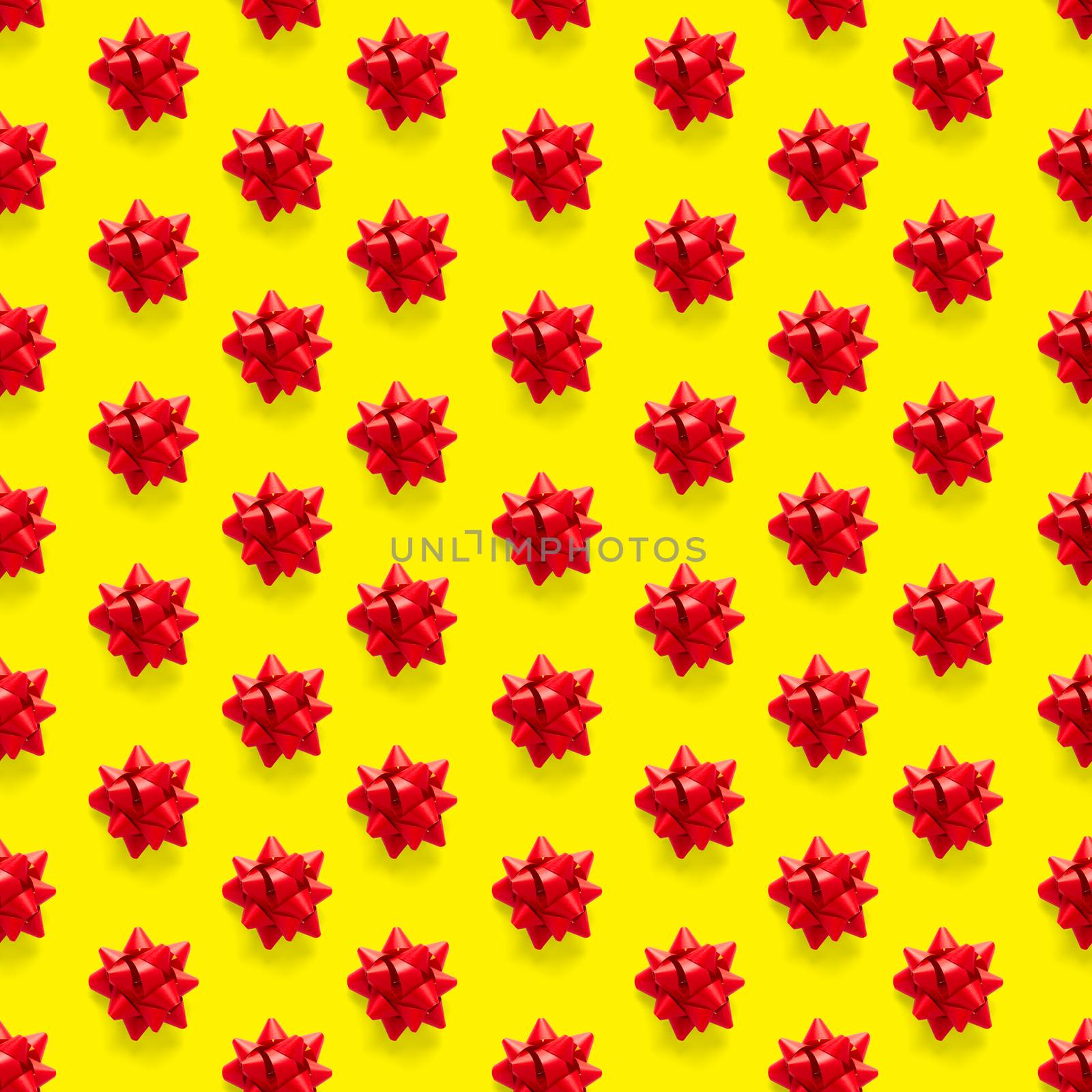 Seamless regular creative Christmas pattern with New Year decorations on yellow background. xmas Modern Seamless pattern made from christmas decorations. Photo quality pattern for fabric, prints, wallpapers, banners or creative design works.