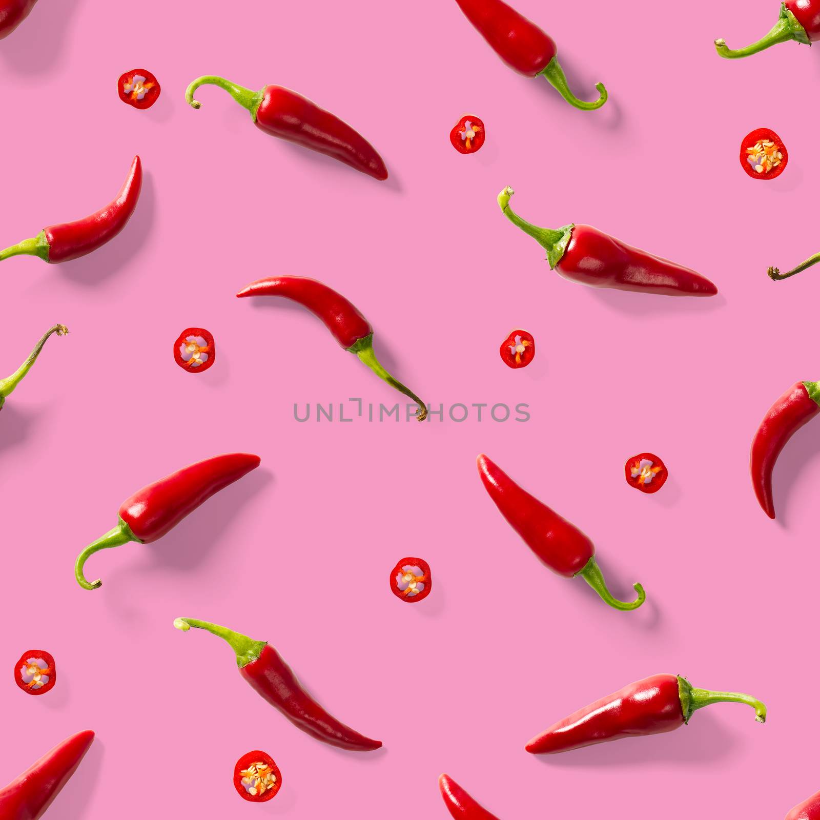 Red hot chilli seamless peppers pattern. Seamless pattern made of red chili or chilli on pink background. Minimal food pattern. Food background.