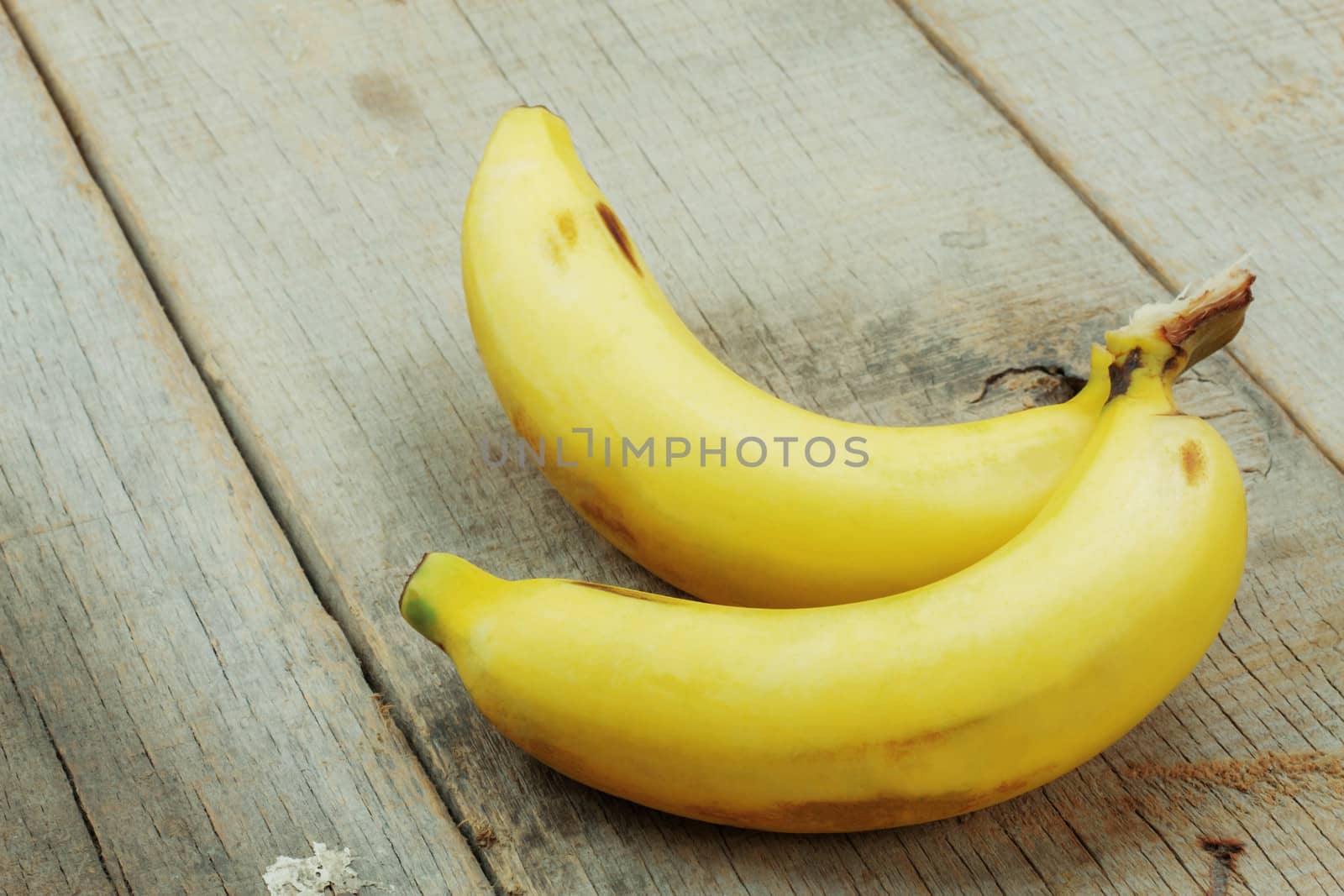 Bananas on the old wooden floor.