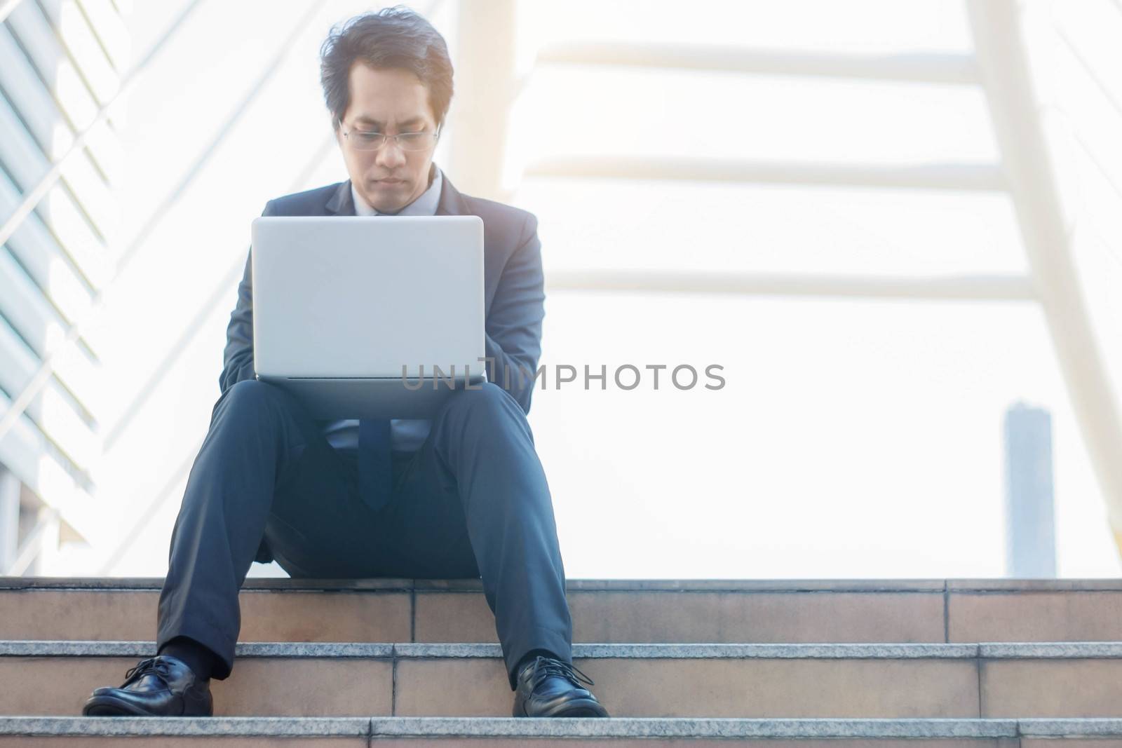 Man sitting and using notebook. by start08