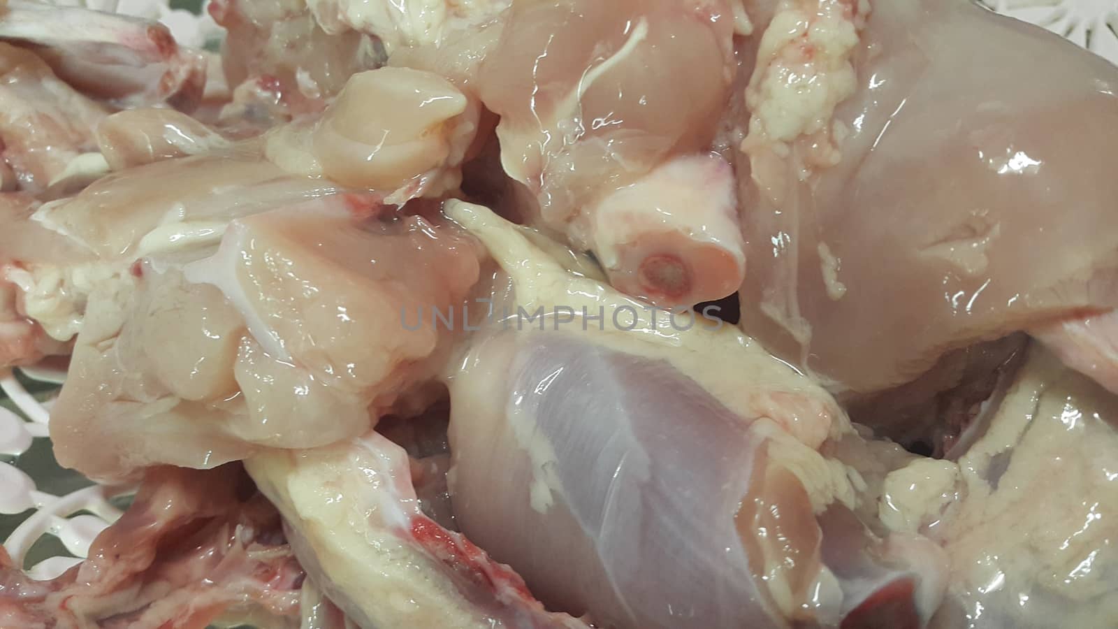 Chicken meat: Close up view of raw, fresh, choped and sliced chicken meat in grocery store use for food and ingredient background. 