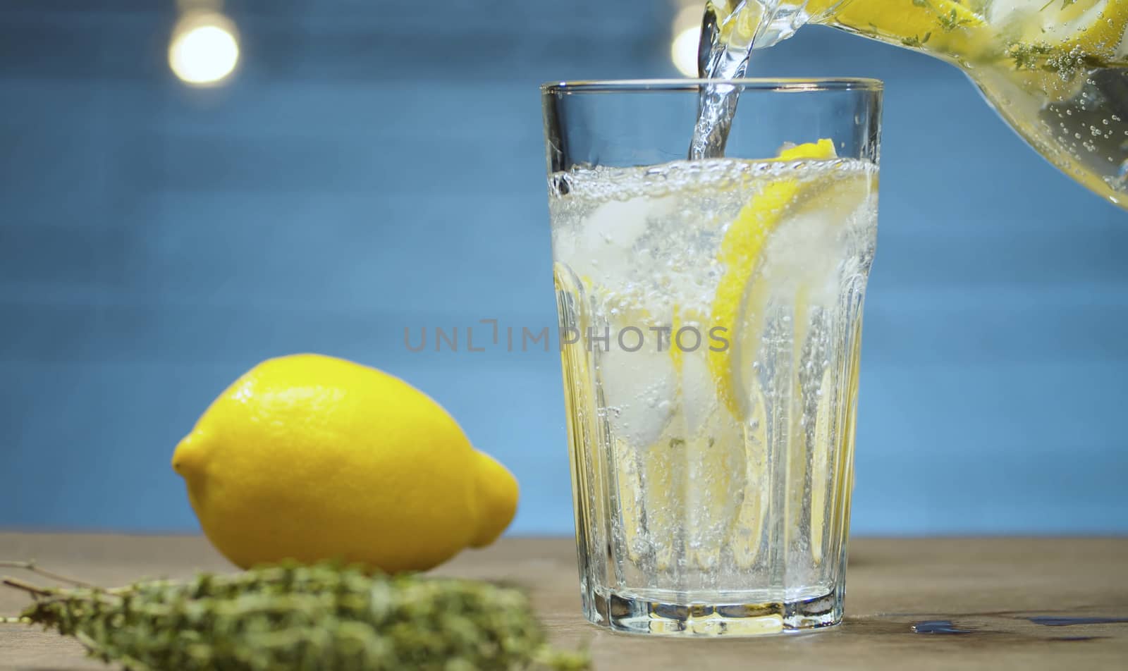 Lemonade pouring into a glass by Alize