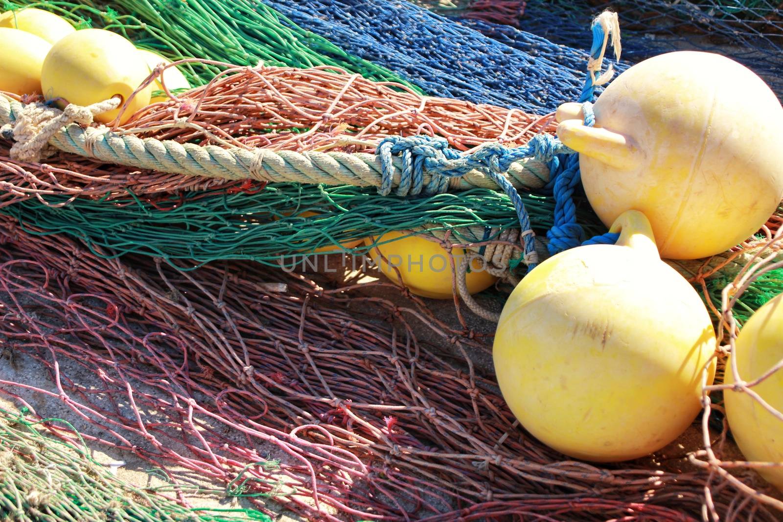 Fishing nets background and colorful buoys in the port of Santa Pola, Alicante