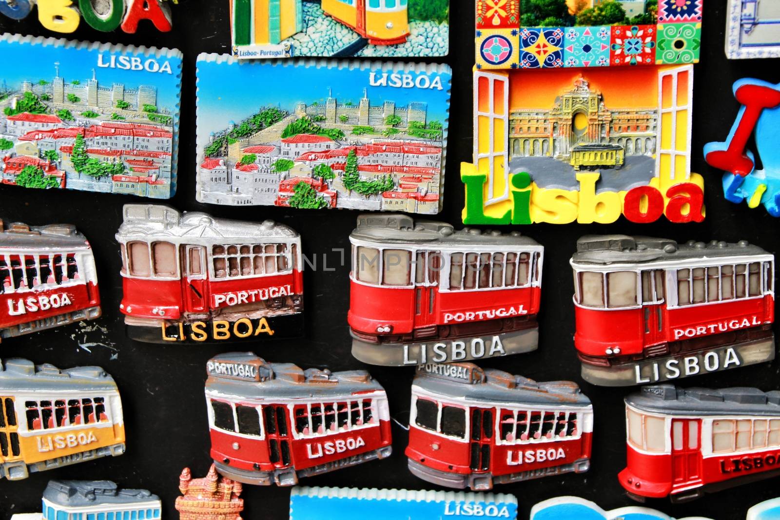 Lisbon, Portugal- March 14, 2019: Colorful magnet tram and tiles souvenirs of Lisbon city. Word Lisbon written.