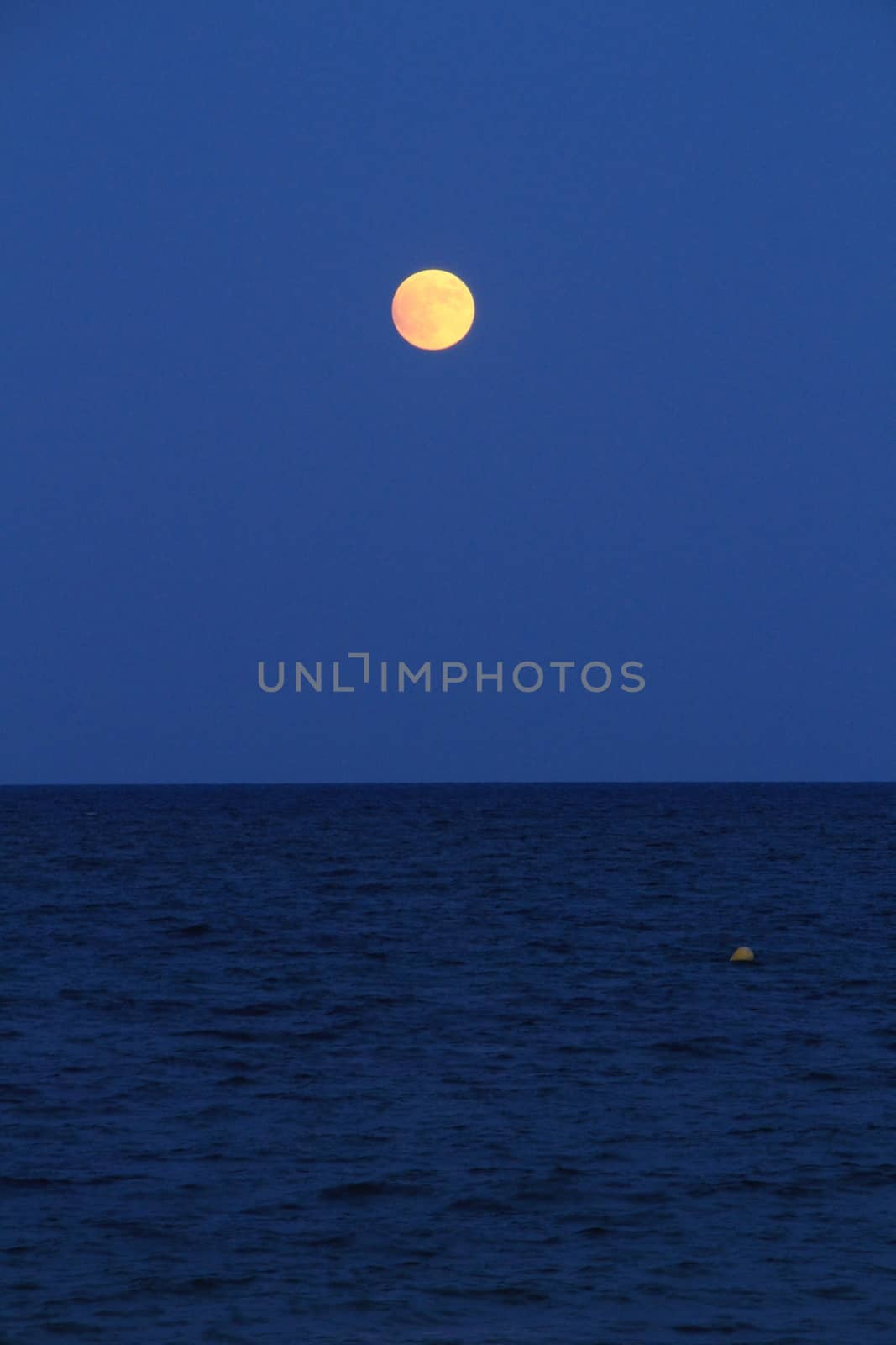 Alicante Beach at dusk with a full moon by soniabonet