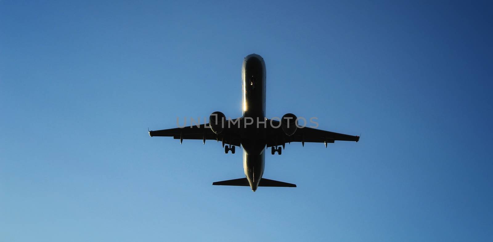 Plane furrowing the sky