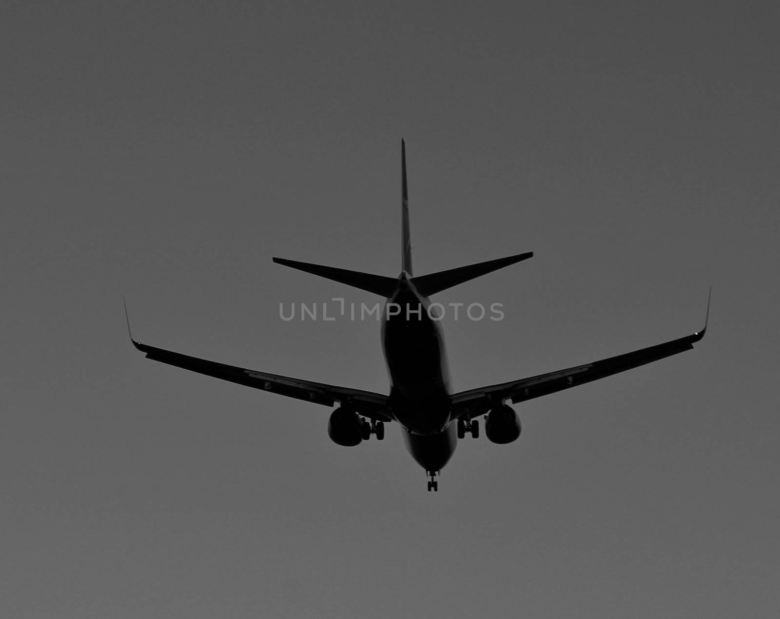 Plane furrowing the sky