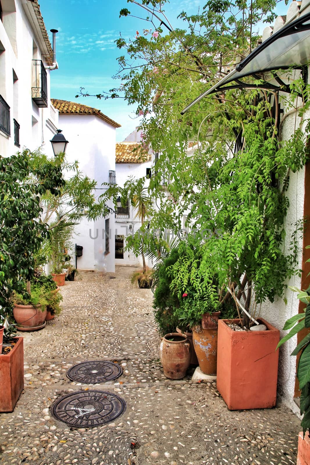 Narrow streets and white facades in Altea by soniabonet