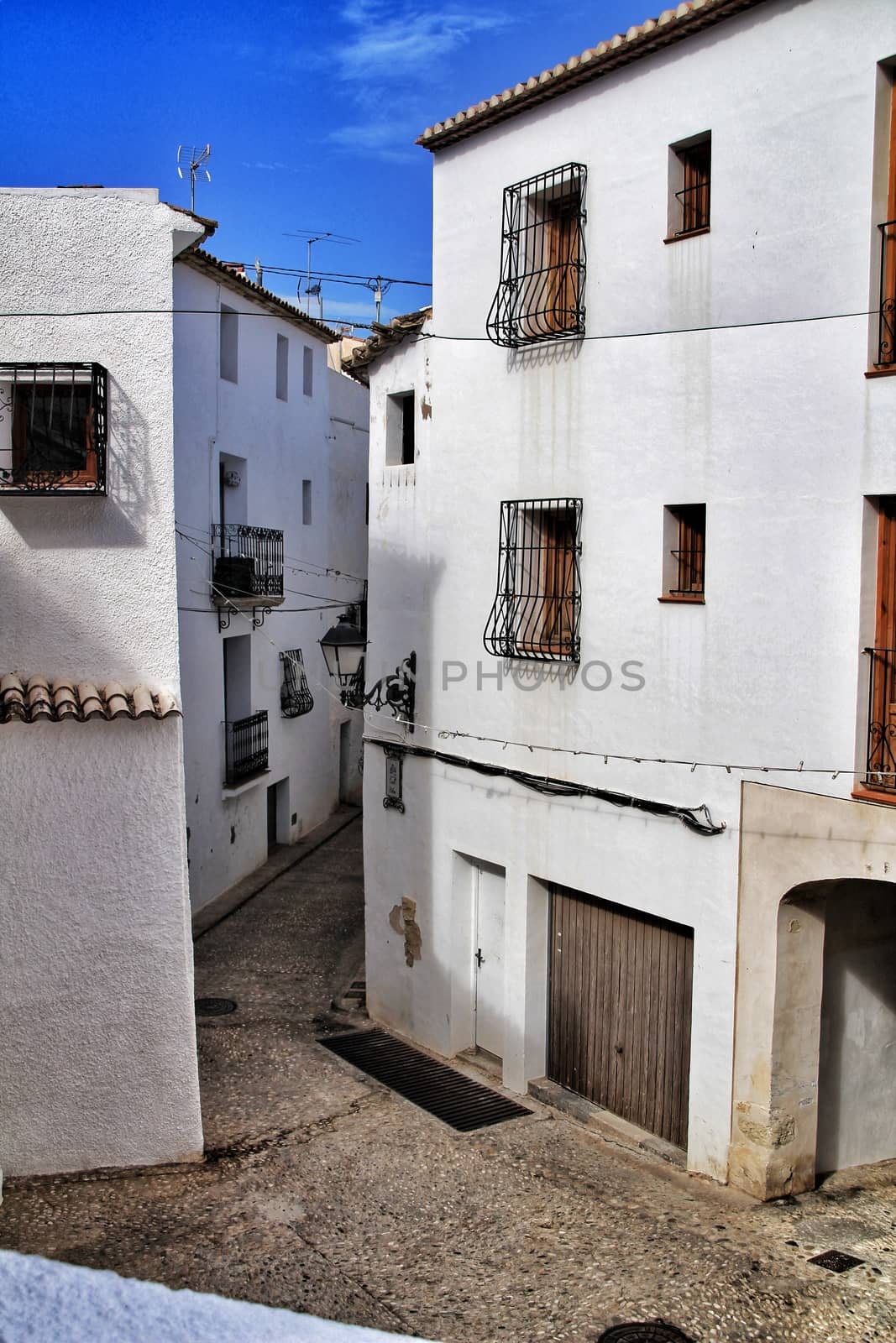 Narrow streets and beautiful white facades in Altea, Alicante, Spain