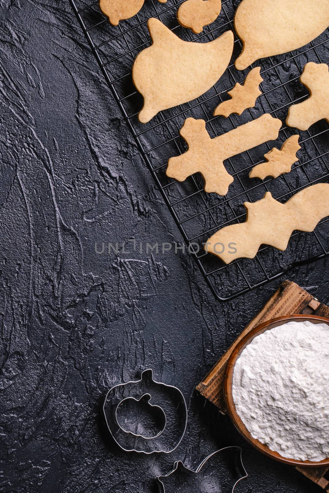 Design concept of top view layout of making Halloween cookies, preparing party, overhead, blank copy space.