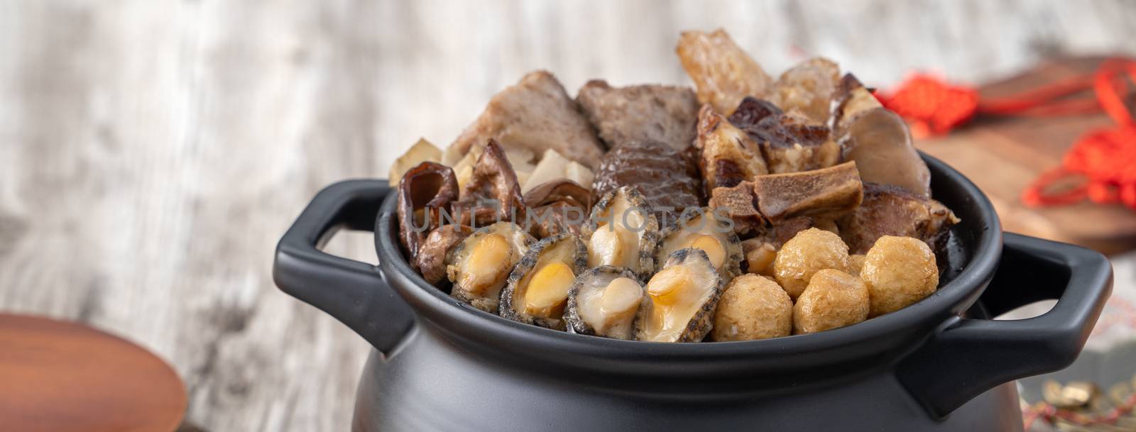 Traditional food of Chinese lunar new year, Buddha jumps over the wall, Chinese Soup Casserole dish, Buddha's Temptation, named Fo Tiao Qiang, close up.