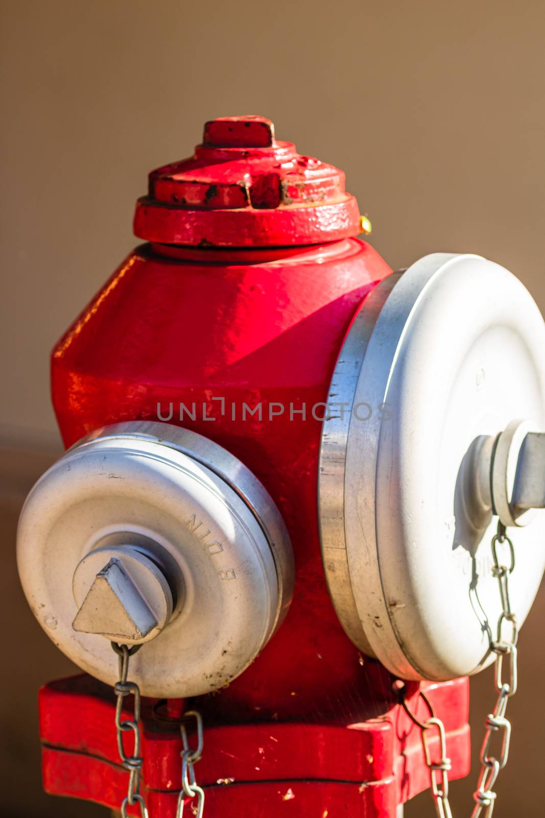 Close up on detail of red street hydrant isolated.