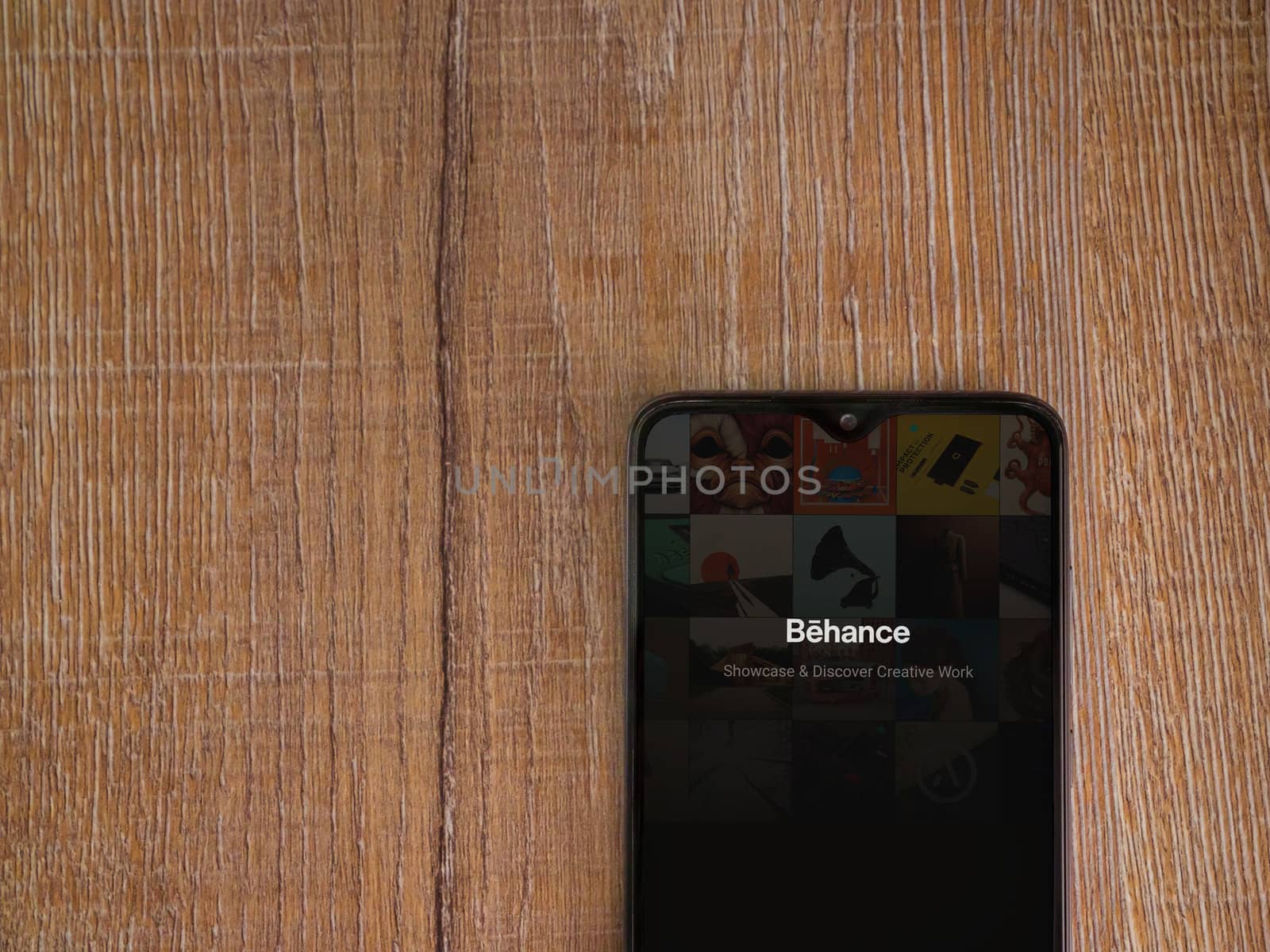 Adobe Behance app launch screen with logo on the display of a bl by wavemovies