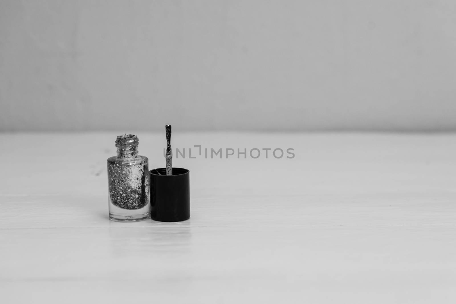 Glittery colorful and bright nail polish isolated with copy spac by vladispas