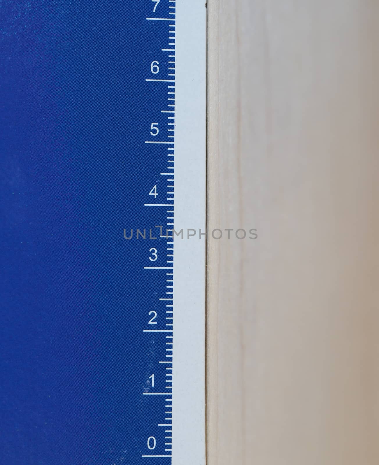 paper ruler with metric units in white over blue