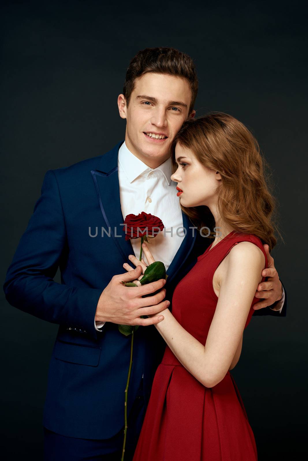 luxury couple hug romance relationship rose over dark isolated background by SHOTPRIME