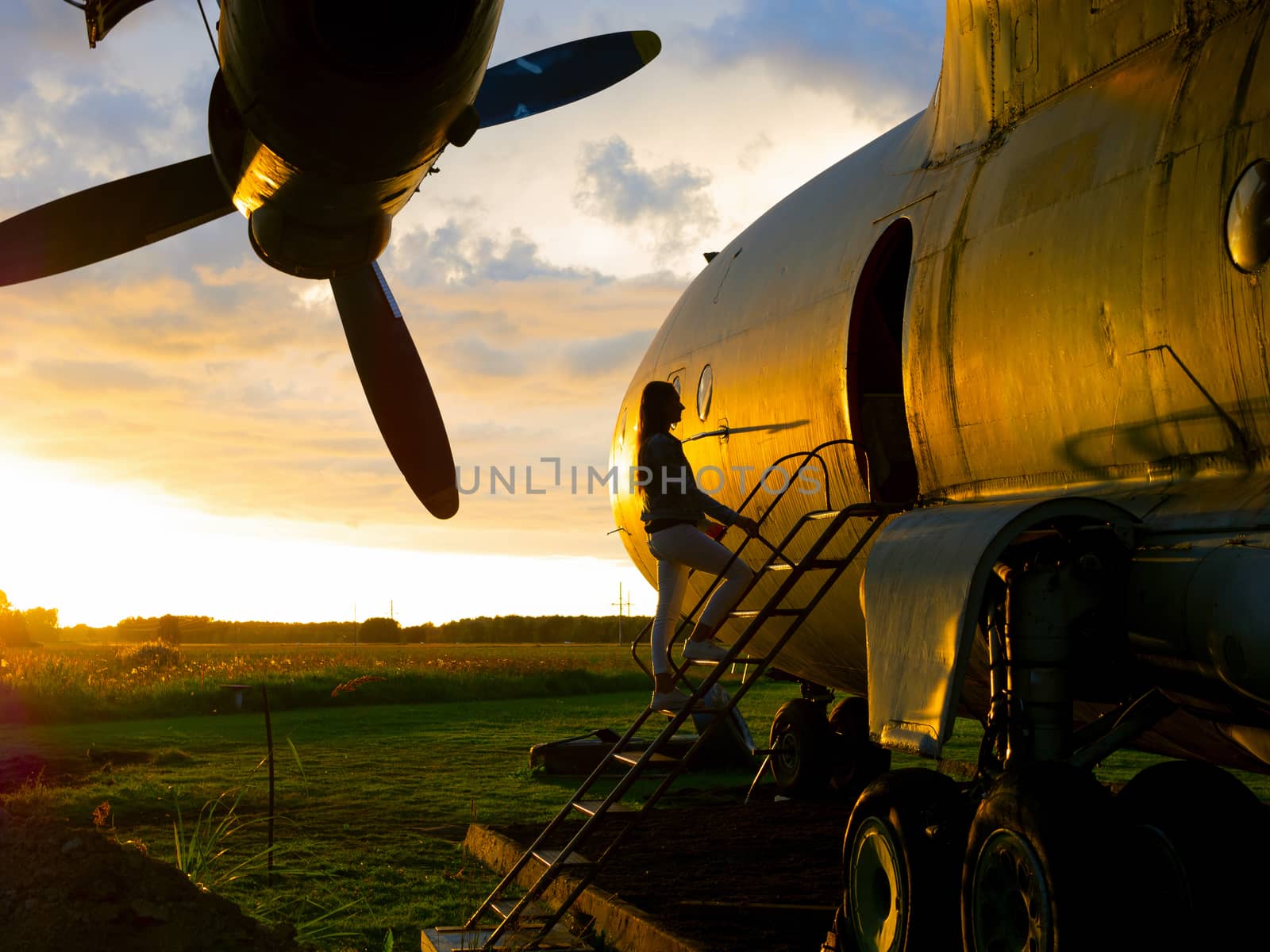 old Soviet military airplane, sunset time. Abandoned Historic Aircraft. Close up of propeller engine. Copy space