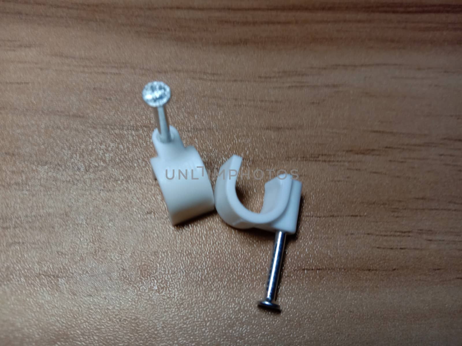 white colored wire pin on wooden table