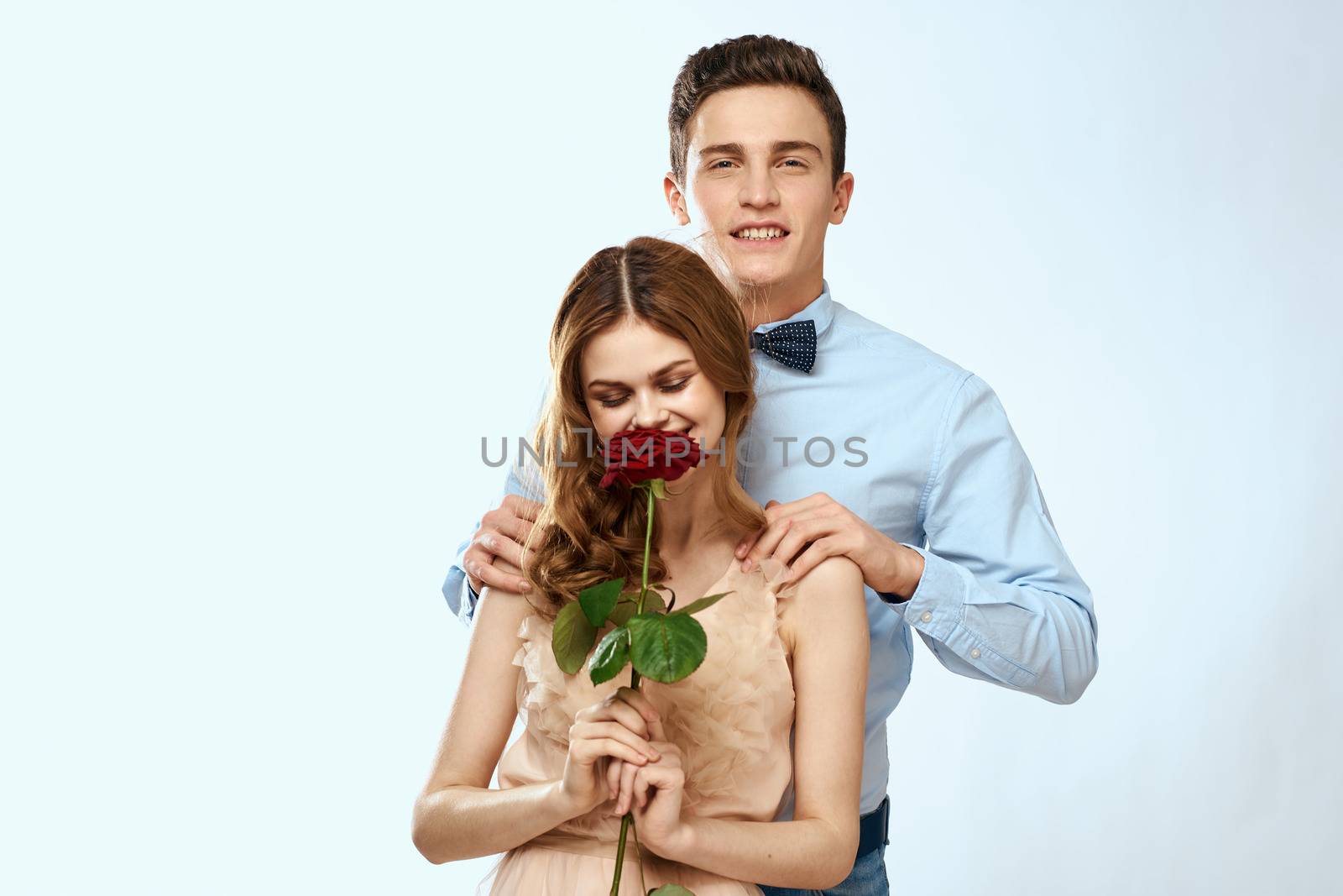 man giving woman roses relationship charm lifestyle embrace lifestyle by SHOTPRIME