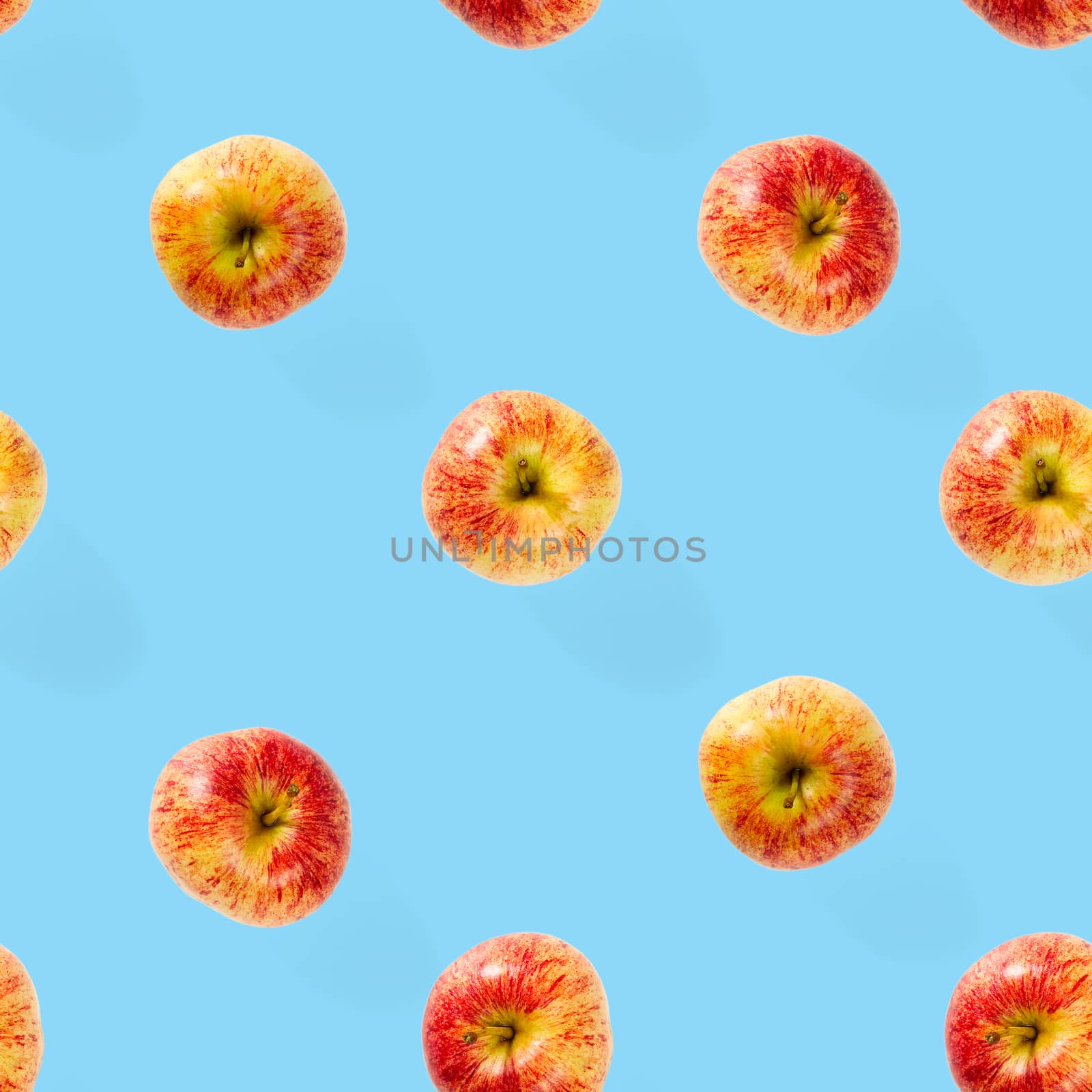 Seamless pattern with ripe apples. Apple seamless pattern on blue background. Tropical fruit abstract background.