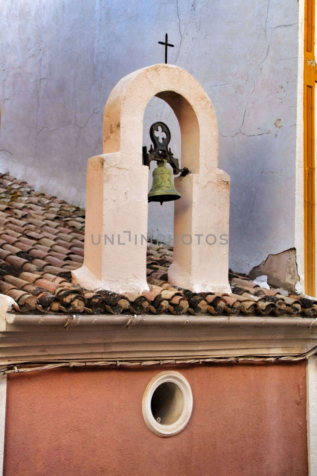Old bell in antique hermitage in Xixona village in Alicante province, Spain