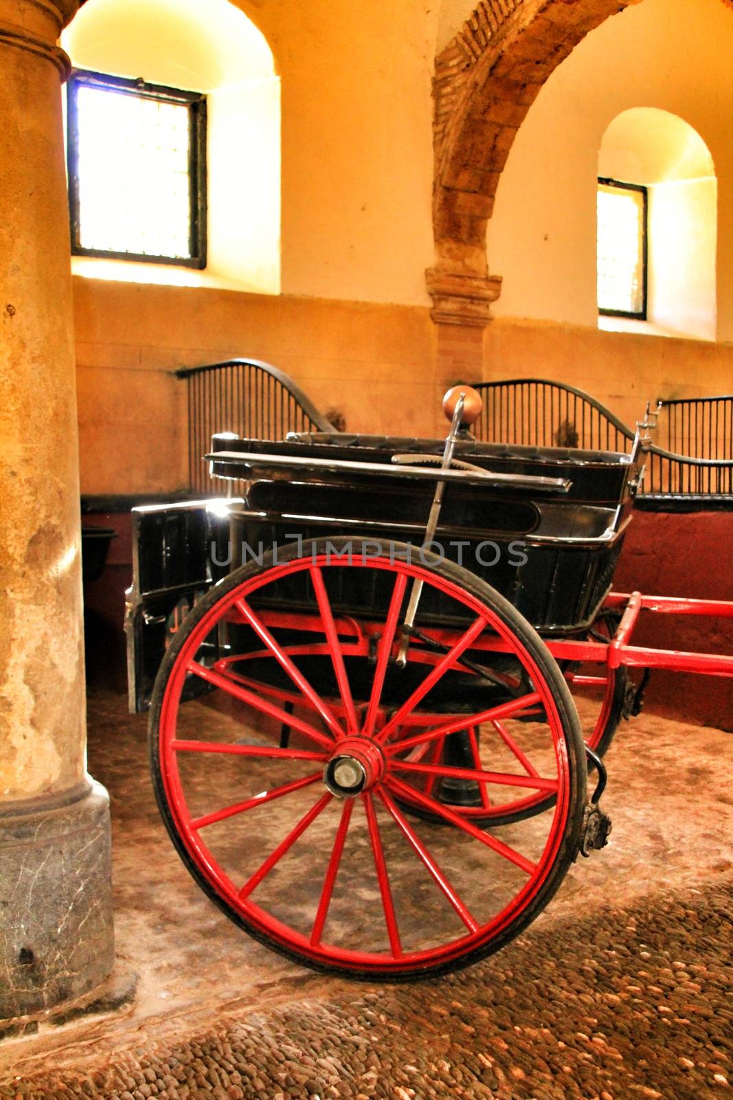 Old carriages in a house in Cordoba, Spain