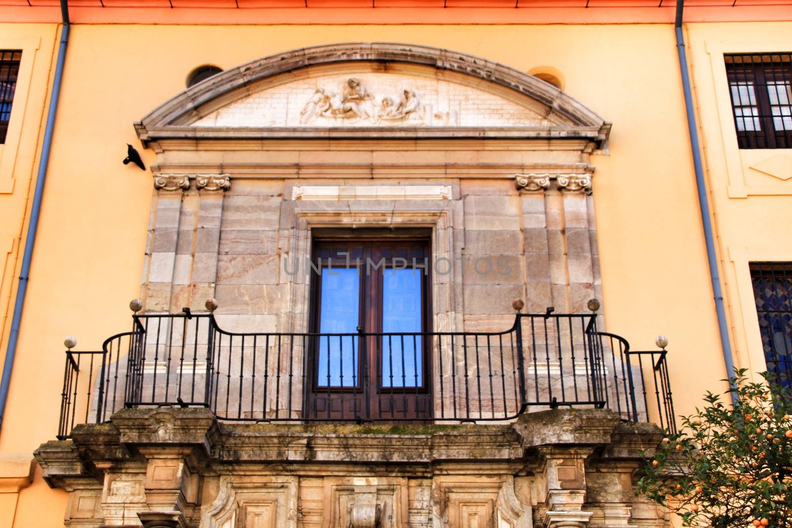 Colorful and majestic old house facade in Cordoba, Spain in a sunny day of winter