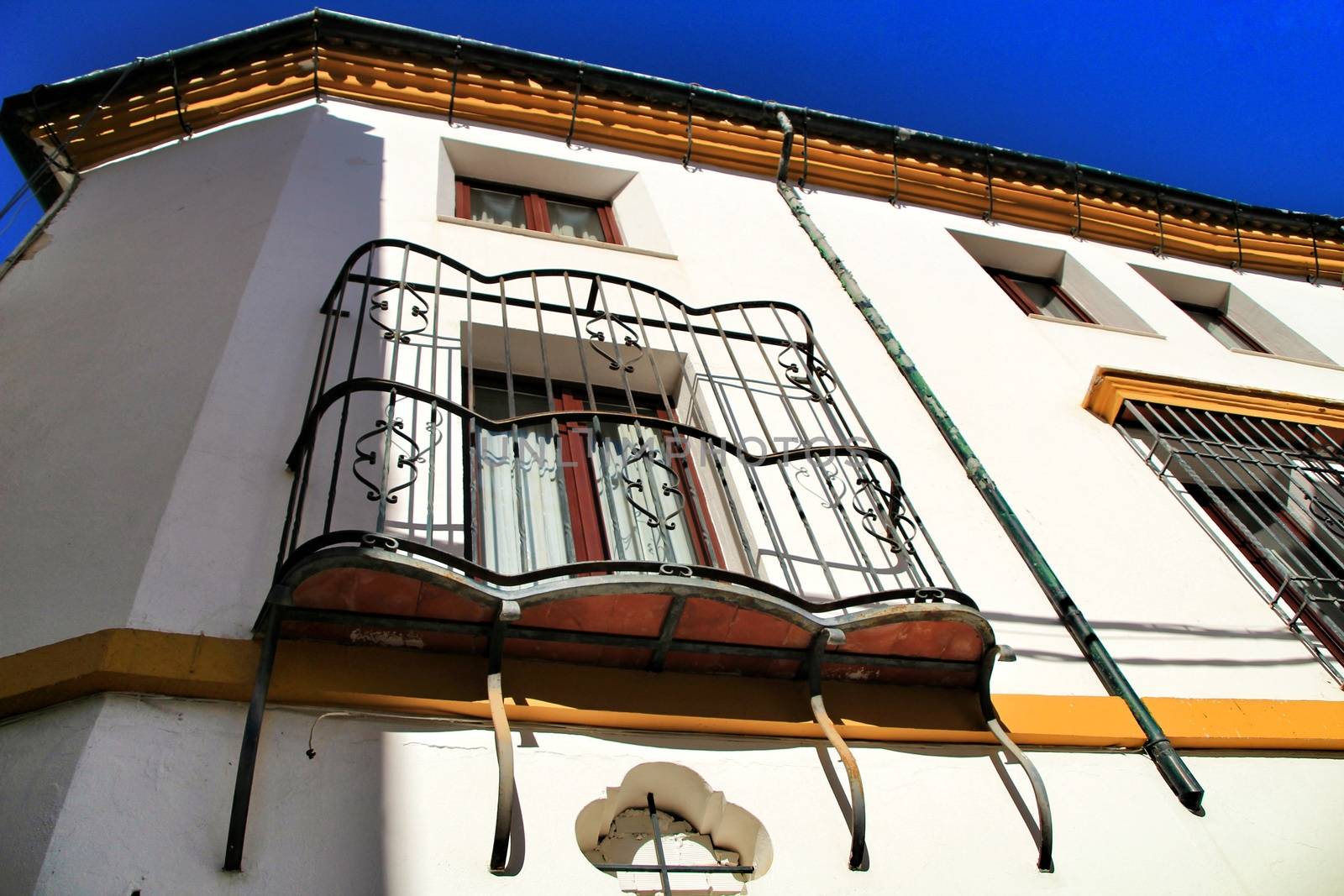 Colorful and majestic old house facade in Cordoba village, Cordoba province, Spain