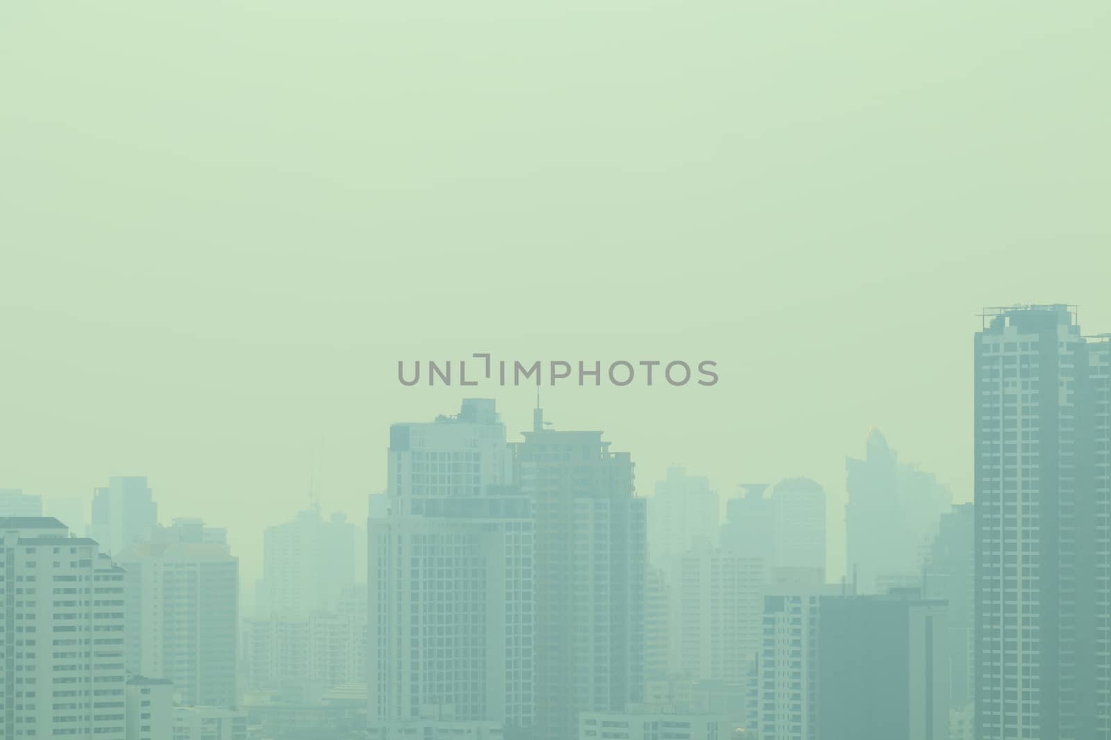 smog city in summer, haze of pollution covers city, global warming concept