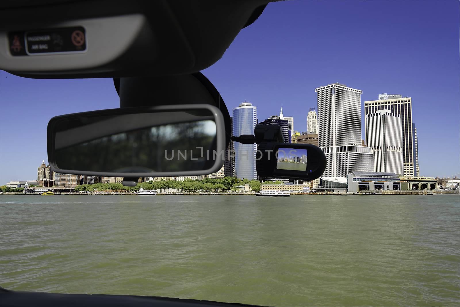 Looking through a dashcam car camera installed on a windshield with view of the financial district of of Manhattan, New York City, USA