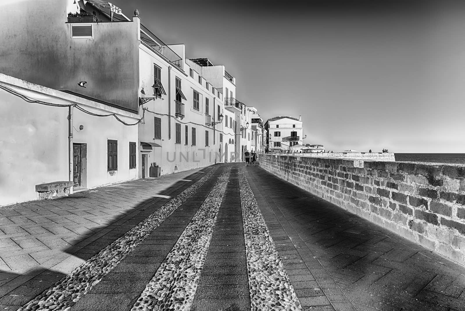 Walking on the historic ramparts in Alghero, Sardinia, Italy by marcorubino