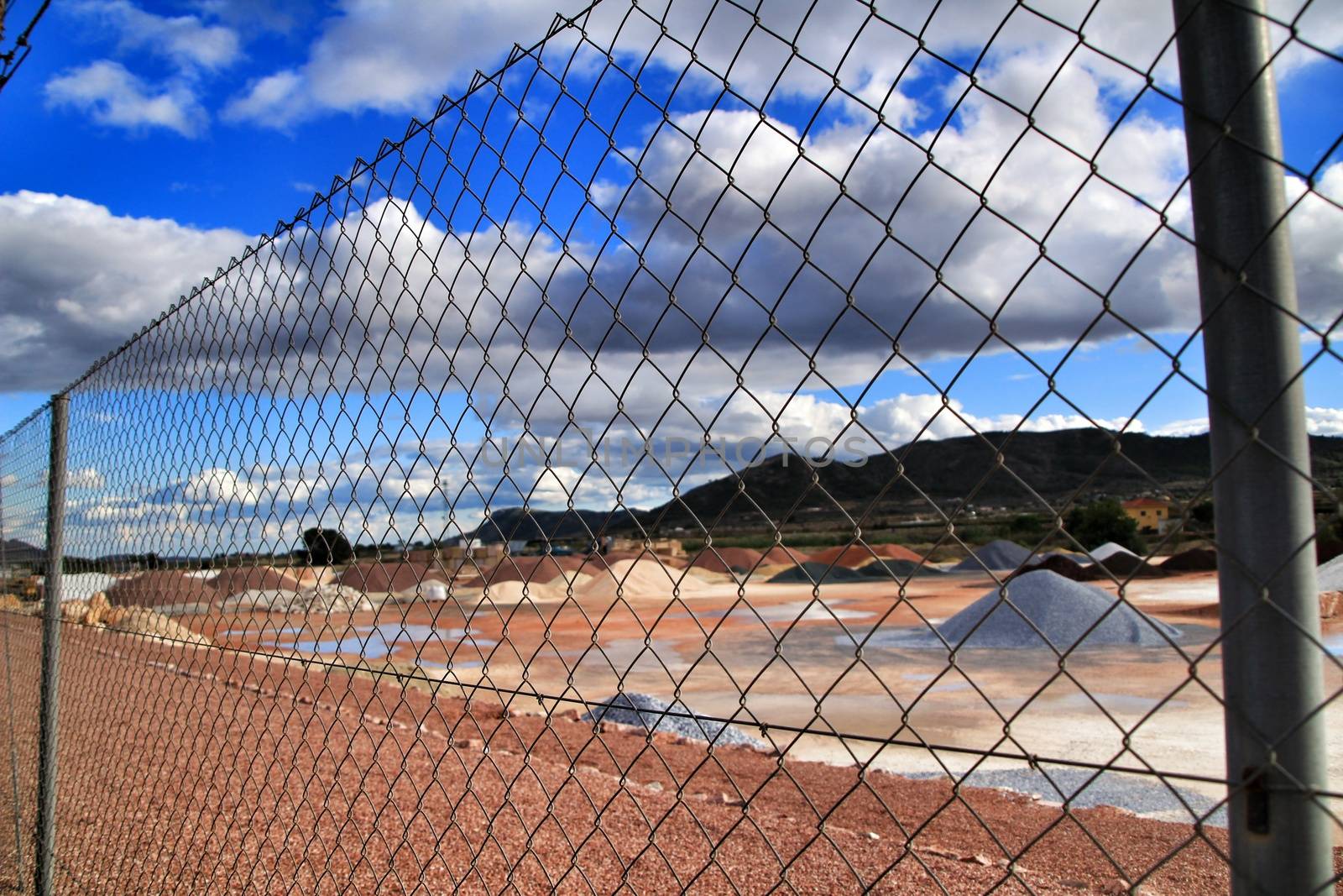 Colorful construction aggregate mountains in Alicante, Spain