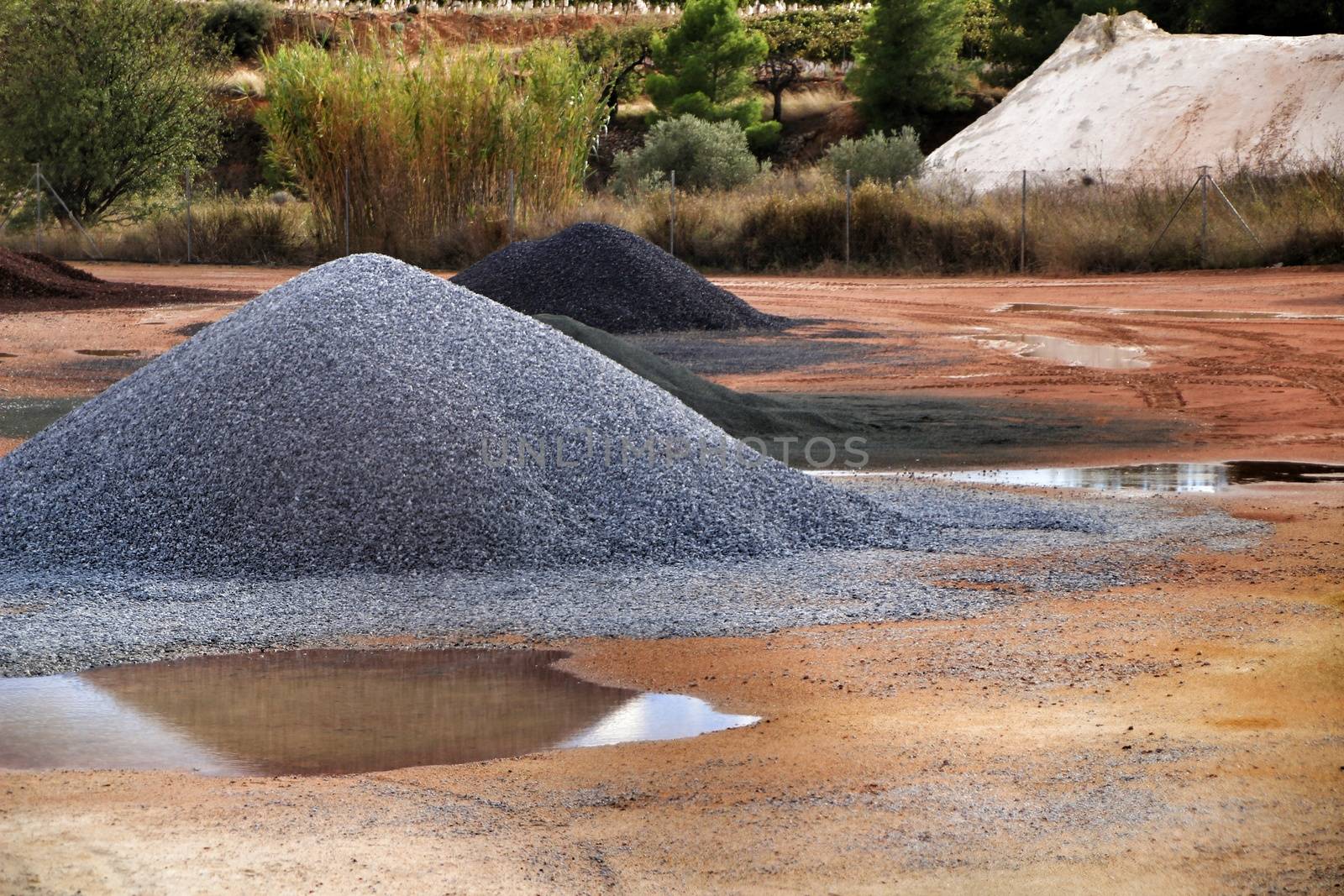 Colorful construction aggregate mountains in Alicante, Spain