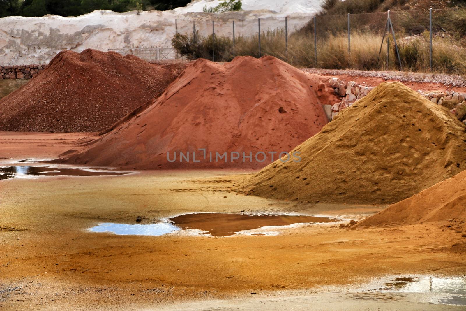 Colorful construction aggregate mountains in Alicante, Spain