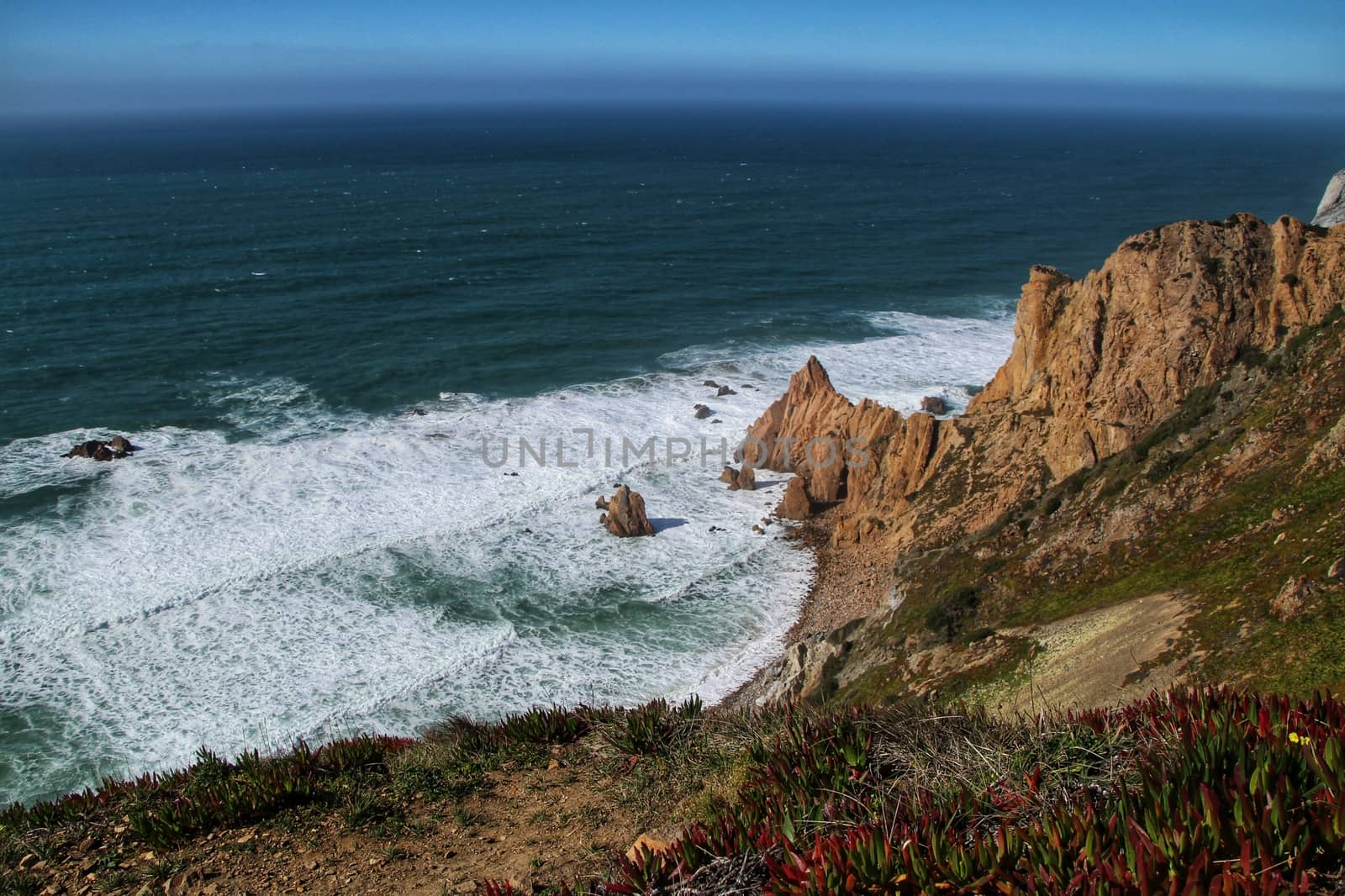Beautiful brave sea and cliffs of the coast of Azenhas do Mar in Portugal in Spring