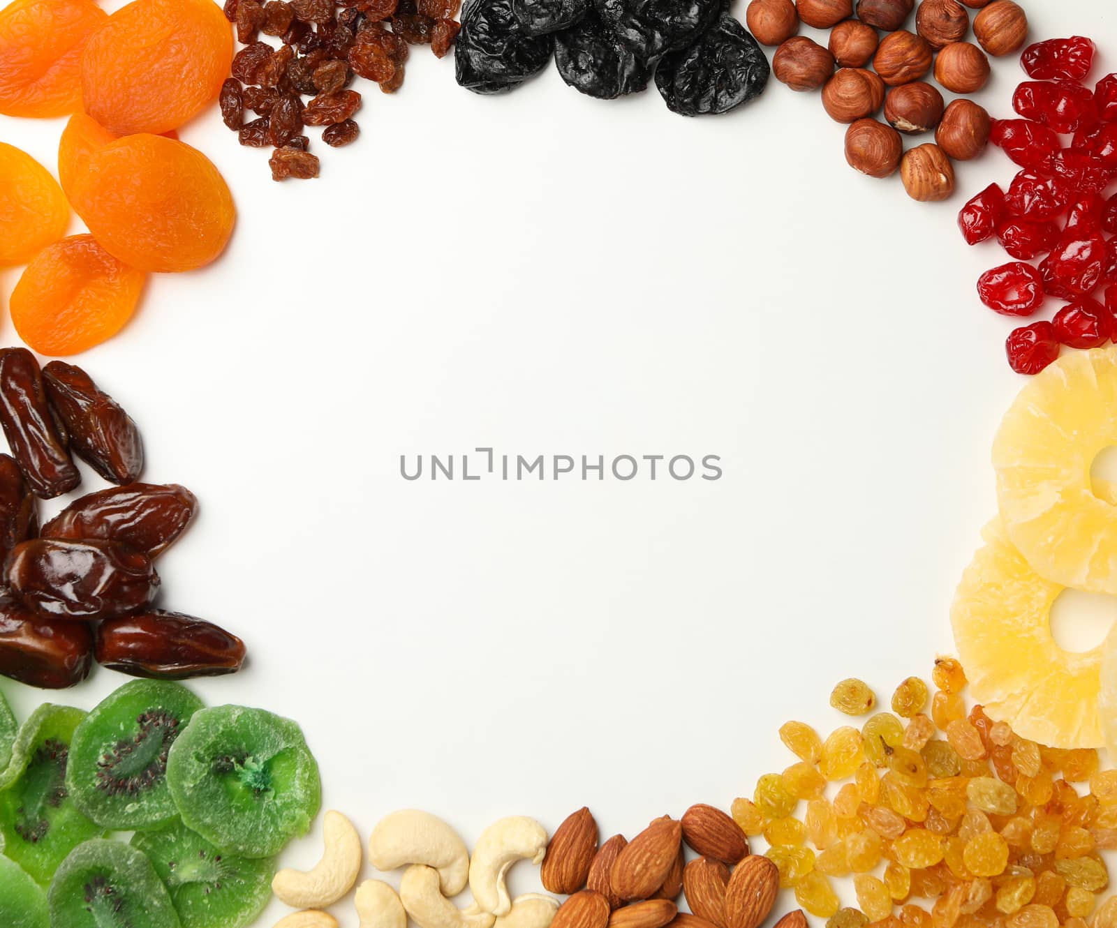 Tasty dried fruits on white background, space for text