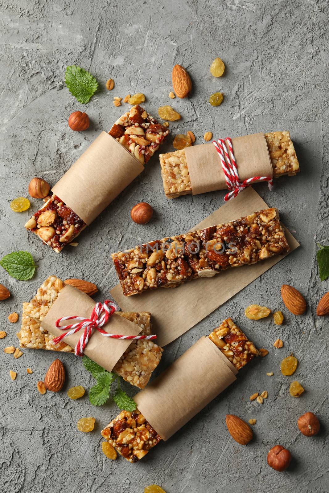 Tasty granola bars on gray background, top view by AtlasCompany