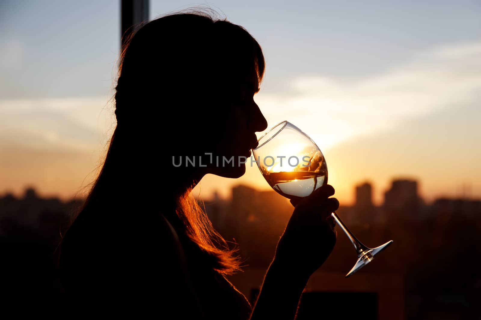 Girl with wine glass. Black silhouette. by 9parusnikov