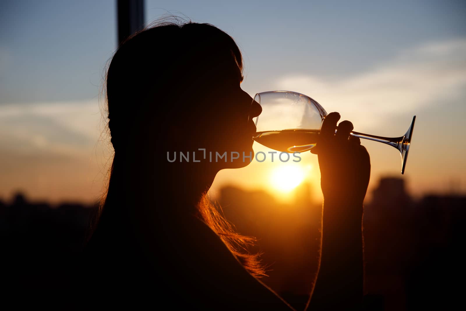 Girl with wine glass. Black silhouette. by 9parusnikov