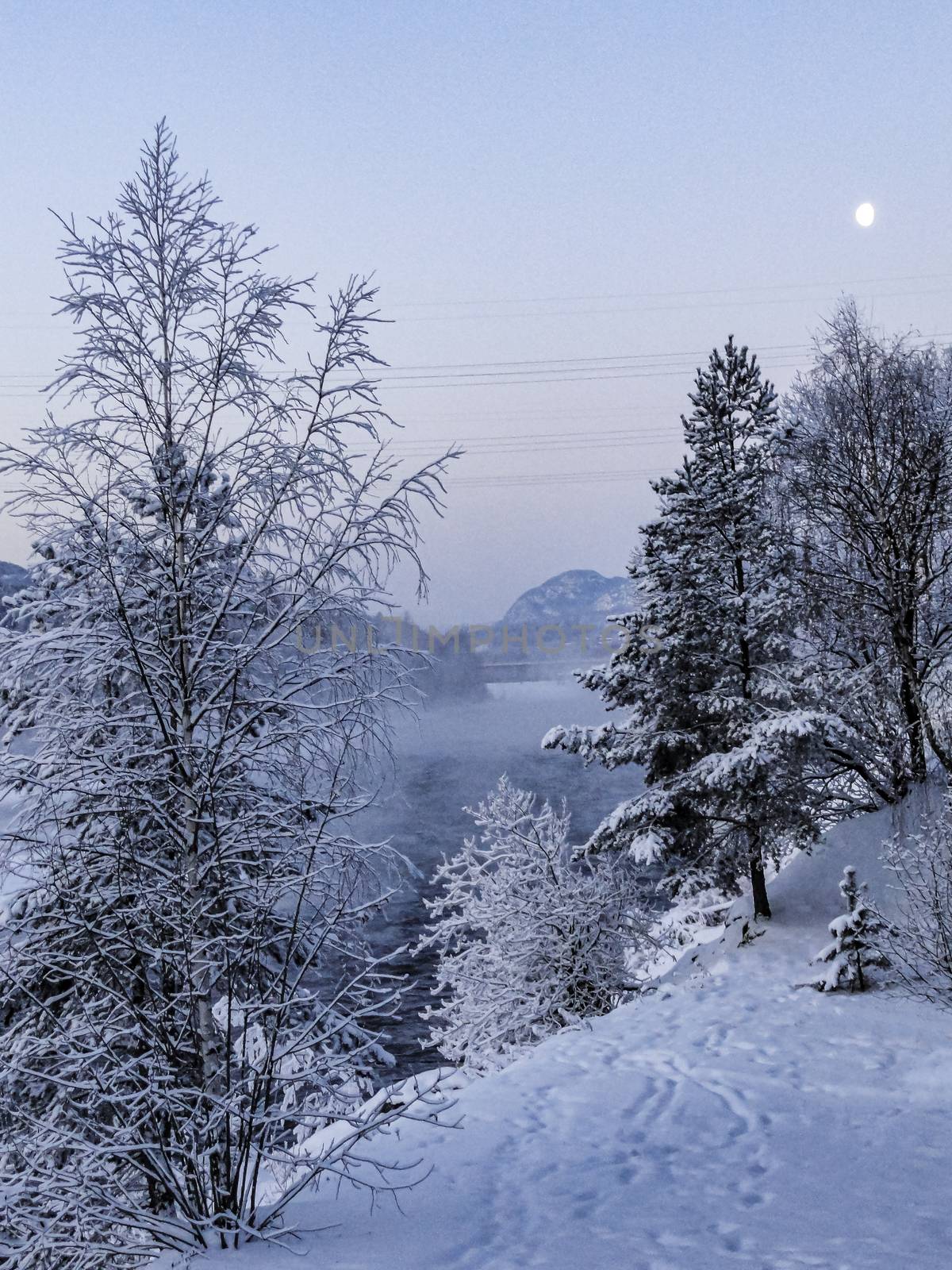 Night and moonlight over the mountains Snow and lakes in wintry Norway.