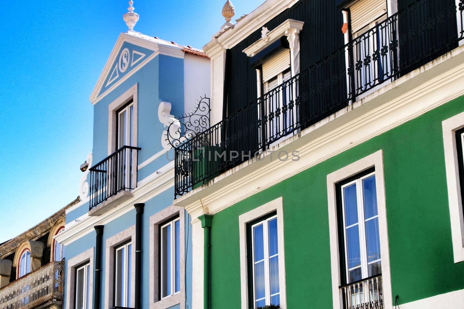 Narrow and colorful streets, majestic facades, windows and balconies of Lisbon, Portugal
