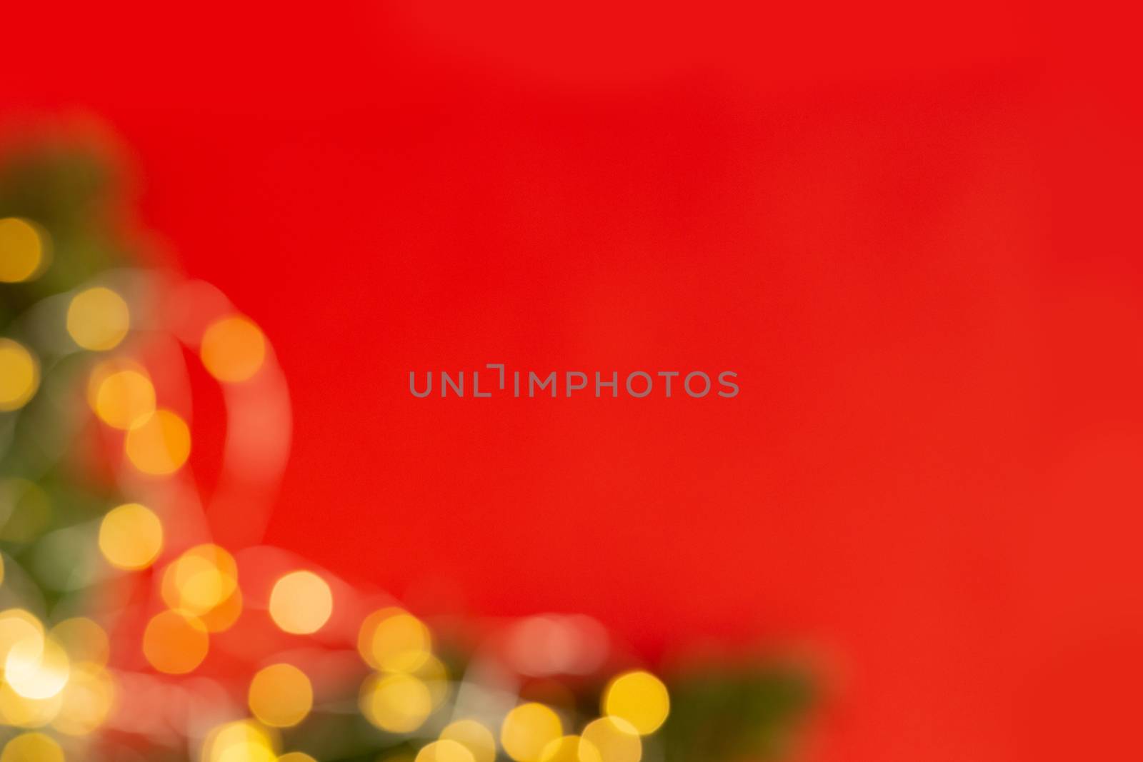 Christmas holiday background with green pine branches with festive bokeh. Ready-to-install products. blur and bokeh. holiday blur lights. copy space. space for text by Pirlik