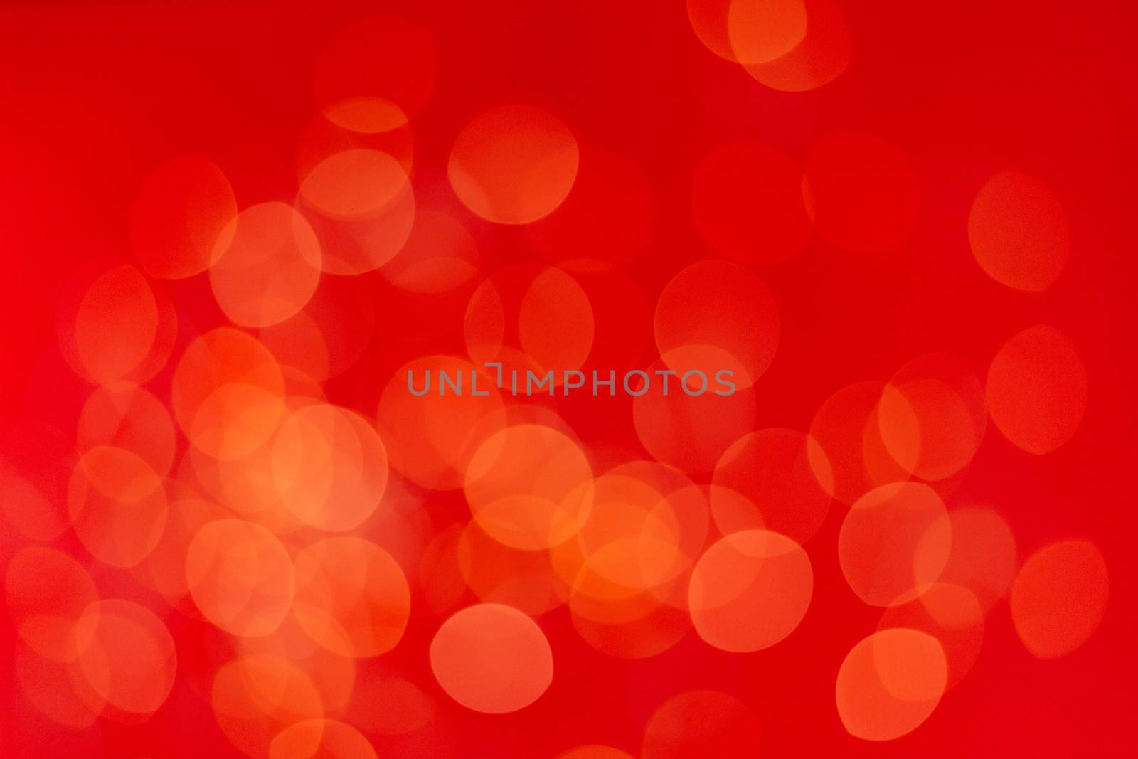 Christmas holiday background with festive bokeh on red background. Ready-to-install products. blur and bokeh. holiday blur lights. copy space. space for text.