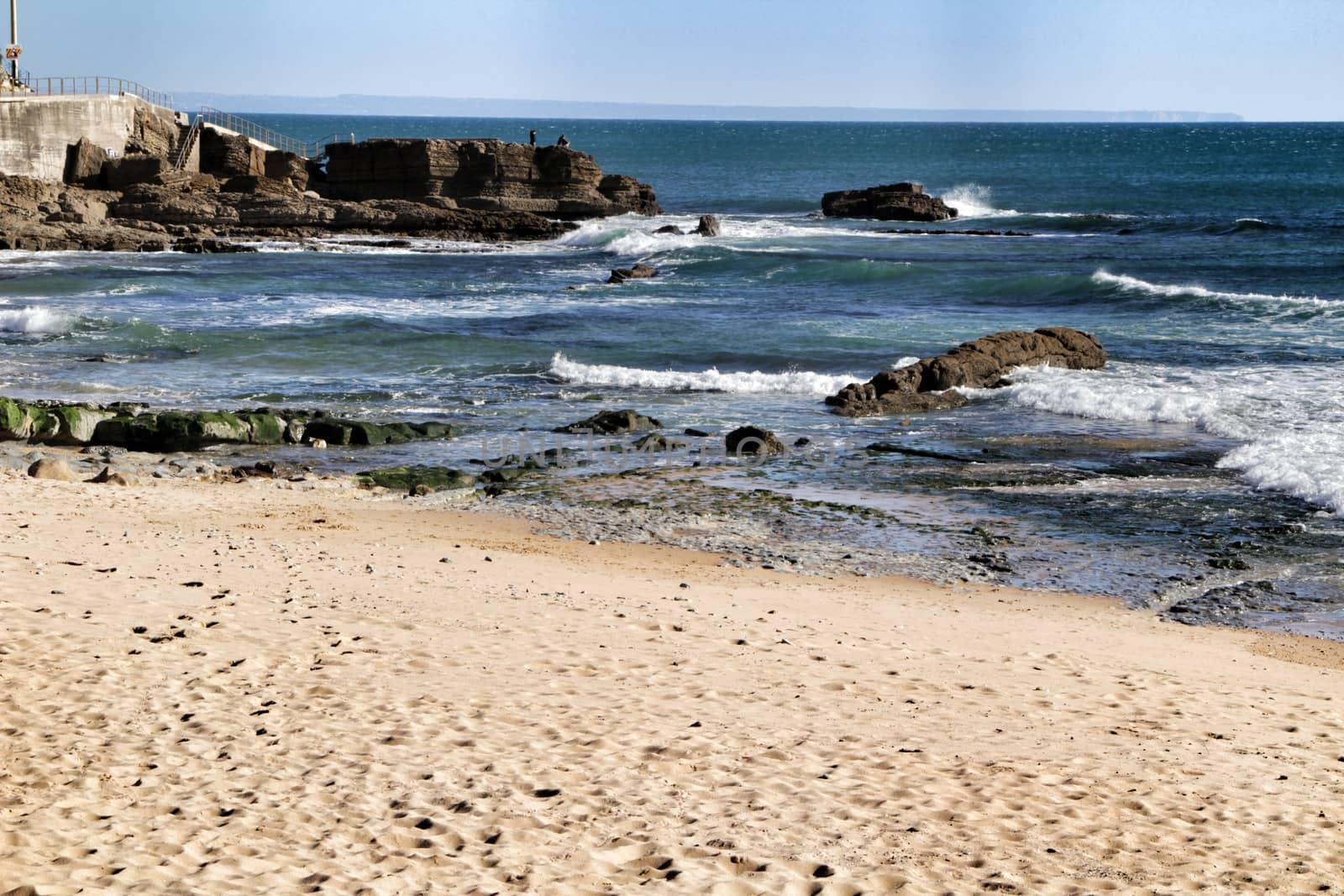 Beautiful Azarujinha beach with rock formations in Estoril, Lisbon, Portugal, in a sunny day of winter