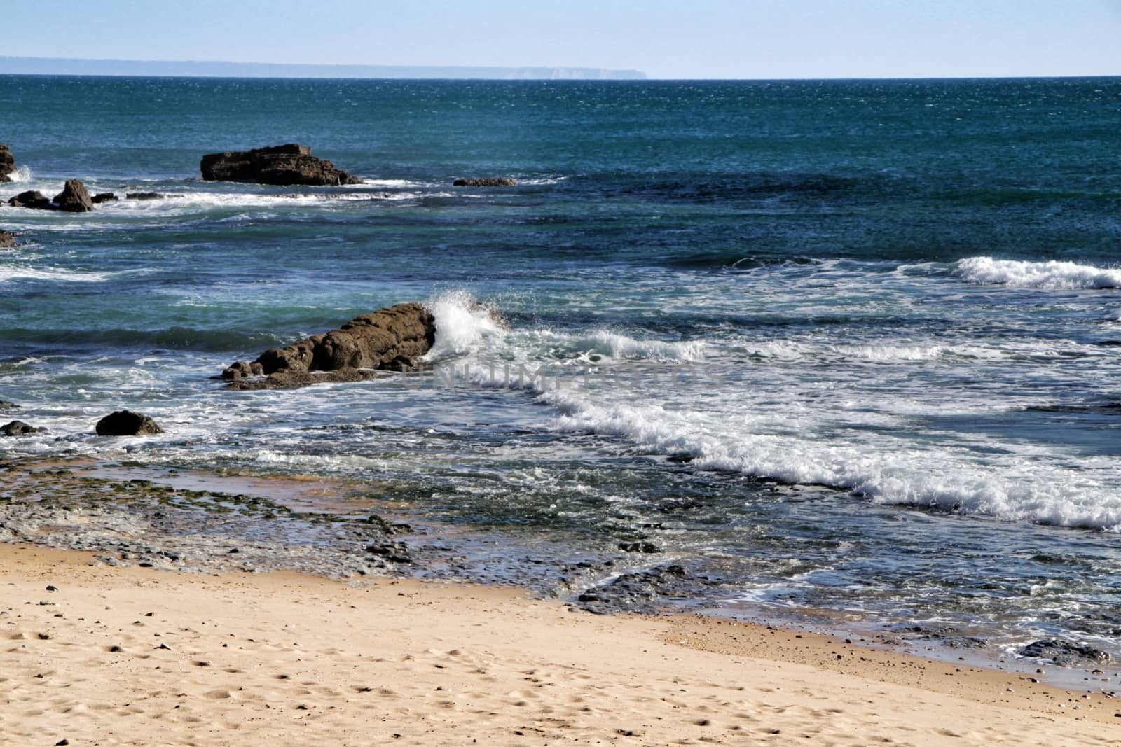 Beautiful Azarujinha beach with rock formations in Estoril, Lisbon, Portugal, in a sunny day of winter