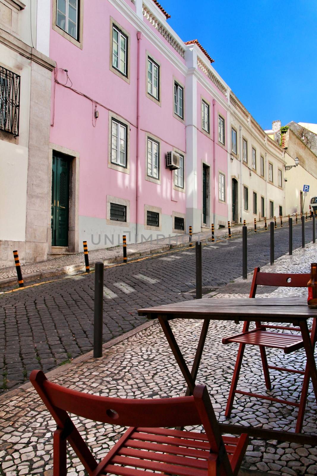 Narrow and colorful streets, majestic facades, windows and balconies of Lisbon, Portugal