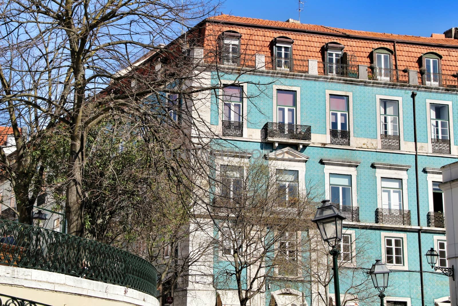 Narrow and colorful streets, majestic facades, windows and balconies of Lisbon, Portugal