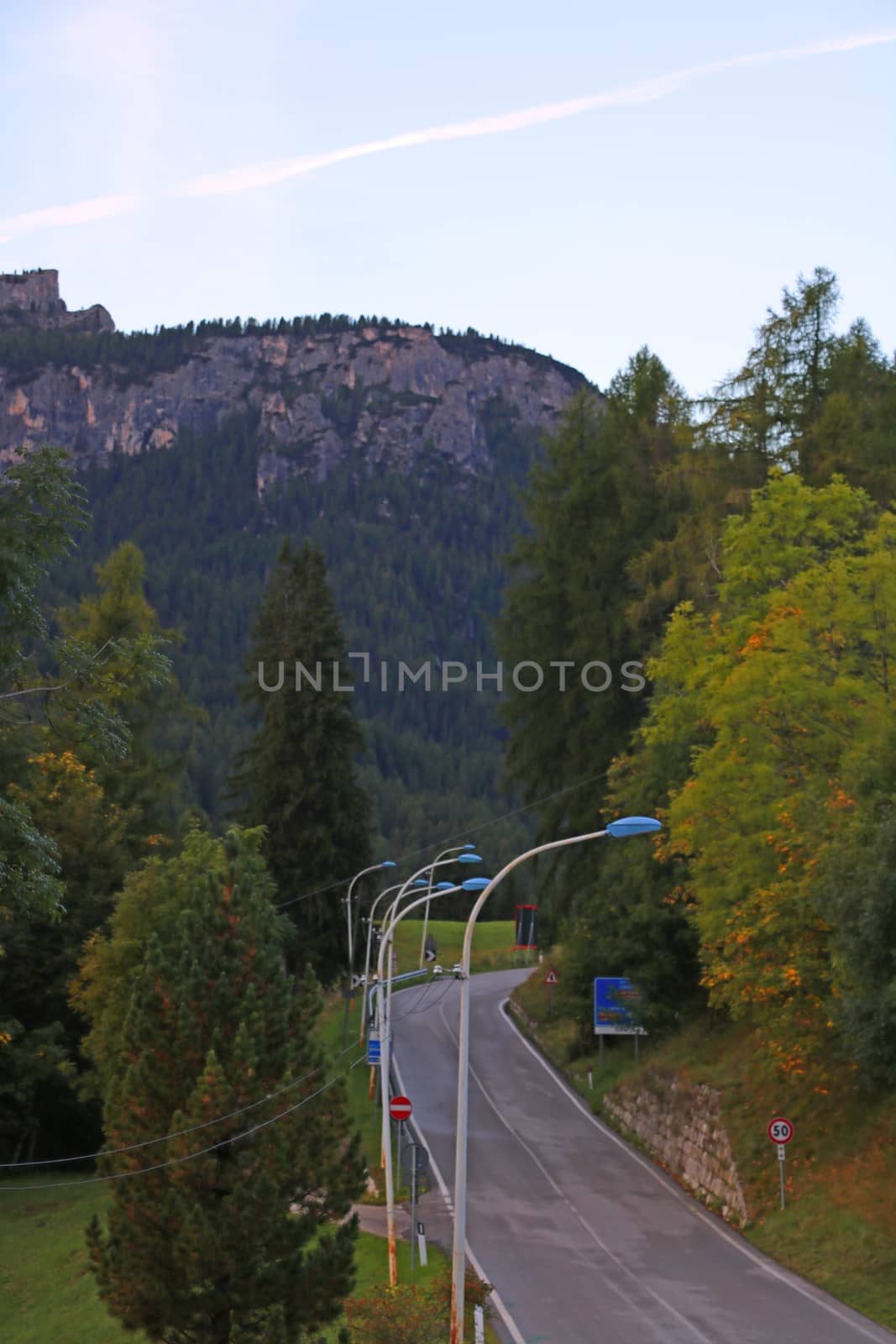 View of the mountain road in the morning or before sunset. Selective focus