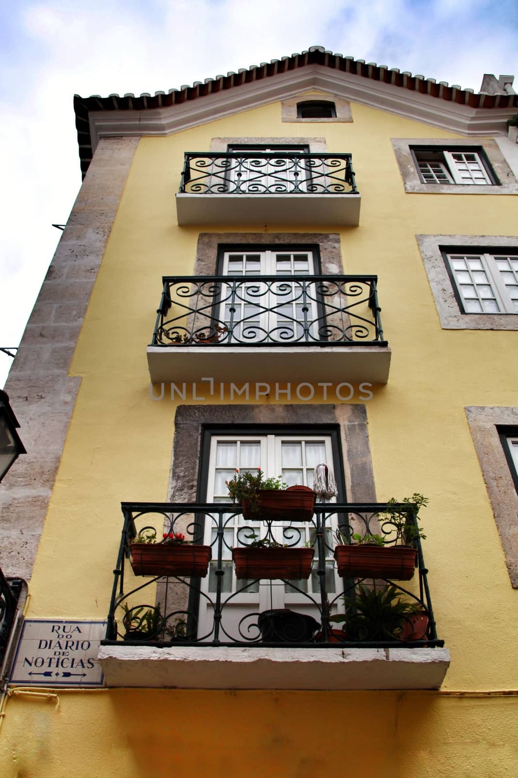 Narrow and colorful streets, majestic facades, windows and balconies of Lisbon, Portugal